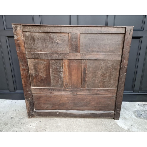 1086 - An antique carved oak box seat settle, 136cm wide.