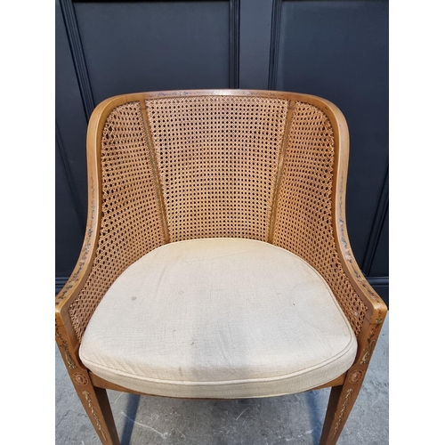 1089 - A pair of late Victorian satinwood, painted and cane tub chairs.  