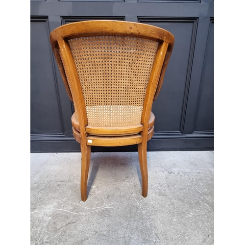 1089 - A pair of late Victorian satinwood, painted and cane tub chairs.  