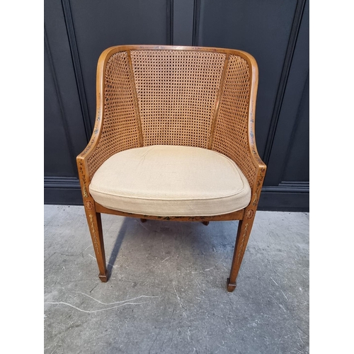 1089 - A pair of late Victorian satinwood, painted and cane tub chairs.  