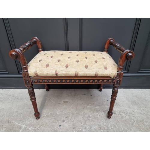 1094 - A reproduction carved hardwood window seat, 68cm wide. 