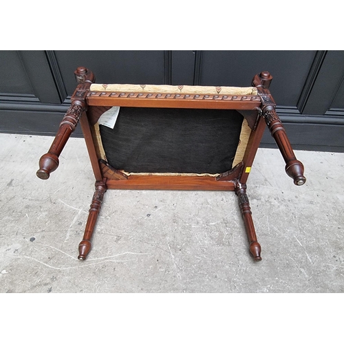 1094 - A reproduction carved hardwood window seat, 68cm wide. 