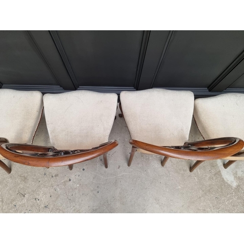 1096 - A set of four Victorian rosewood balloon back dining chairs.