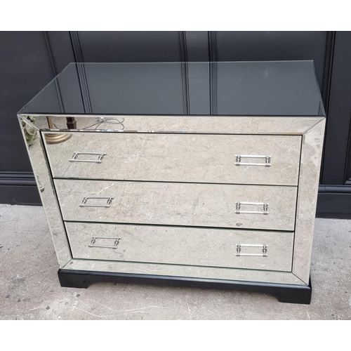 1102 - A contemporary mirrored chest of drawers. 101cm wide. 