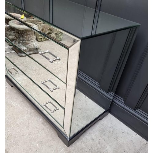 1102 - A contemporary mirrored chest of drawers. 101cm wide. 