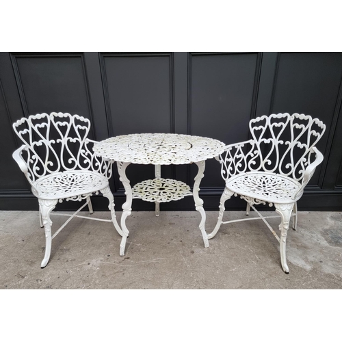 1105 - A white painted aluminium garden suite, comprising: a small bench, 92.5cm wide; a circular table, 78... 