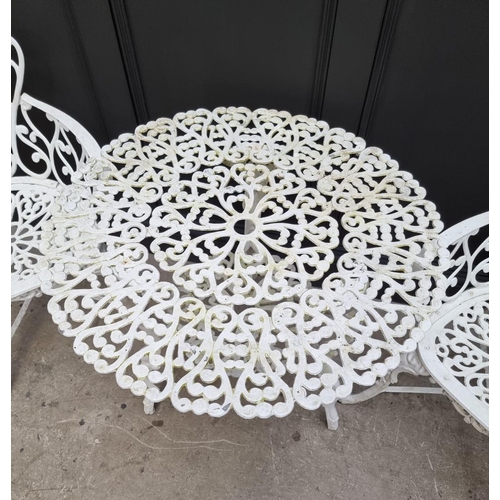 1105 - A white painted aluminium garden suite, comprising: a small bench, 92.5cm wide; a circular table, 78... 