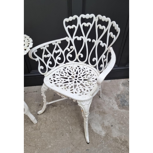 1105 - A white painted aluminium garden suite, comprising: a small bench, 92.5cm wide; a circular table, 78... 