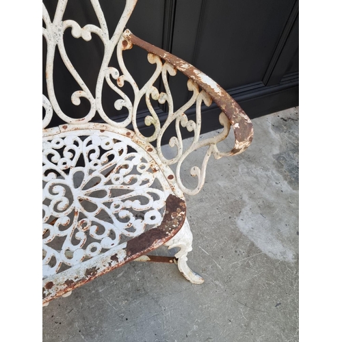 1106 - An old white painted wrought and cast iron bench, 93cm wide. 