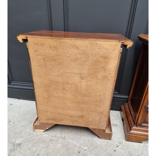 1108 - A pair of hardwood bedside chests, 59.5cm wide.