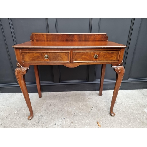 1111 - An old mahogany two drawer serving table, 106cm wide.