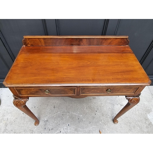 1111 - An old mahogany two drawer serving table, 106cm wide.