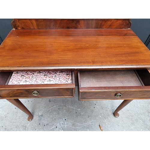 1111 - An old mahogany two drawer serving table, 106cm wide.