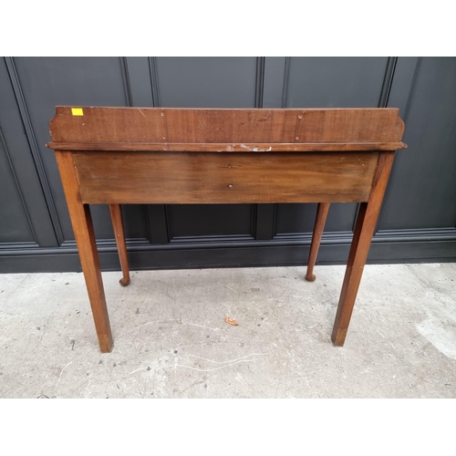 1111 - An old mahogany two drawer serving table, 106cm wide.