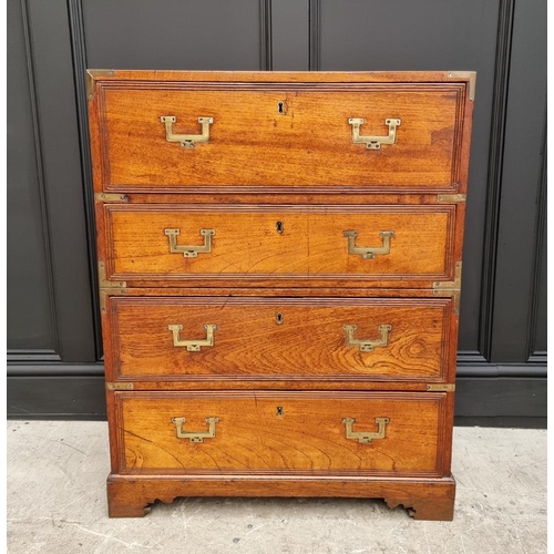 1112 - An unusually small 19th century teak and brass bound campaign chest, with secretaire drawer and side... 