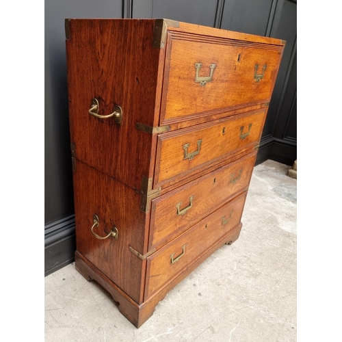 1112 - An unusually small 19th century teak and brass bound campaign chest, with secretaire drawer and side... 