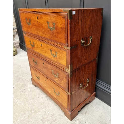 1112 - An unusually small 19th century teak and brass bound campaign chest, with secretaire drawer and side... 