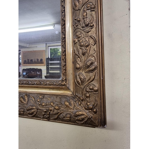 1113 - A late 19th century gilt gesso frame wall mirror, 102.5 x 61.5cm.  