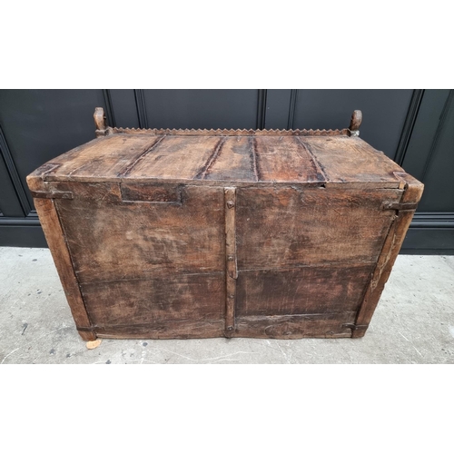 1115 - An Indian carved hardwood chest, with small central cupboard door, 97.5cm wide. ... 