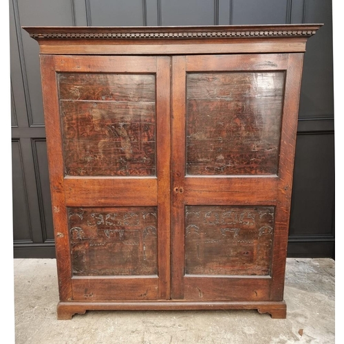 1116 - An 18th century oak press cupboard, incorporating 17th century Italian Cypress wood panels, 164cm wi... 