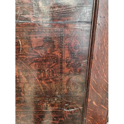 1116 - An 18th century oak press cupboard, incorporating 17th century Italian Cypress wood panels, 164cm wi... 