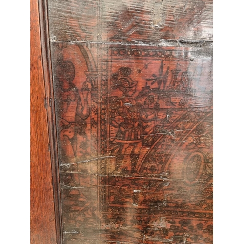 1116 - An 18th century oak press cupboard, incorporating 17th century Italian Cypress wood panels, 164cm wi... 