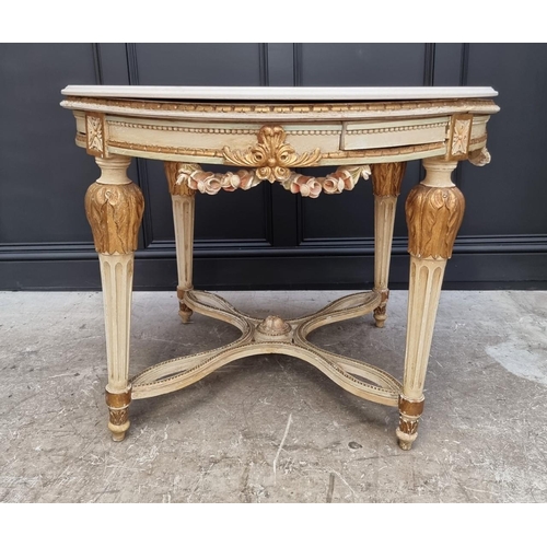 1117 - An old Louis XVI style cream painted and parcel gilt circular centre table, with travertine top and ... 