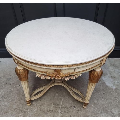 1117 - An old Louis XVI style cream painted and parcel gilt circular centre table, with travertine top and ... 