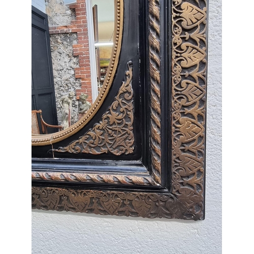 1120 - A black lacquered and parcel gilt framed rectangular wall mirror, 65 x 55.5cm. ... 