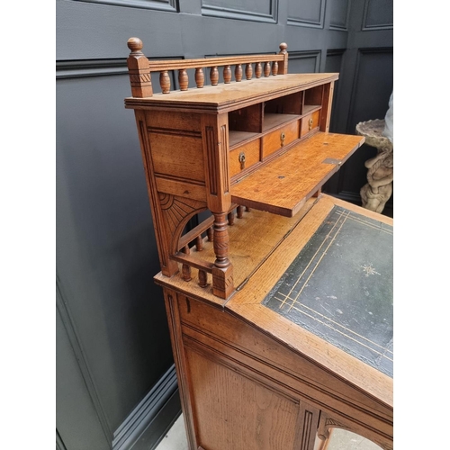 1121 - An unusual late Victorian oak Davenport, 61cm wide.