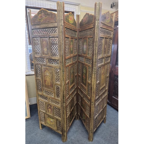 1122 - An antique Indian pierced and painted wood four fold screen, each panel 183 x 51cm. ... 