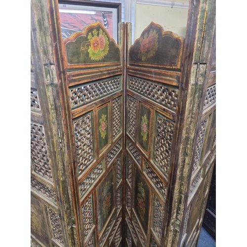 1122 - An antique Indian pierced and painted wood four fold screen, each panel 183 x 51cm. ... 