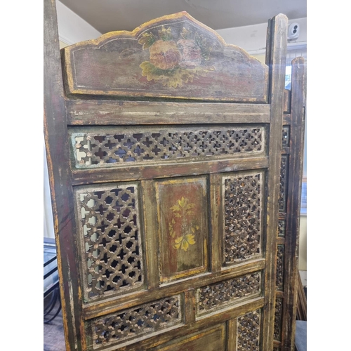 1122 - An antique Indian pierced and painted wood four fold screen, each panel 183 x 51cm. ... 