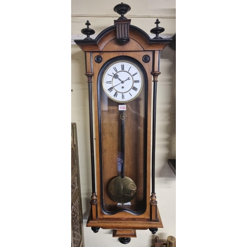 1123 - A late 19th century walnut and ebonized Vienna wall clock, with enamel dial, 114cm high, with pendul... 