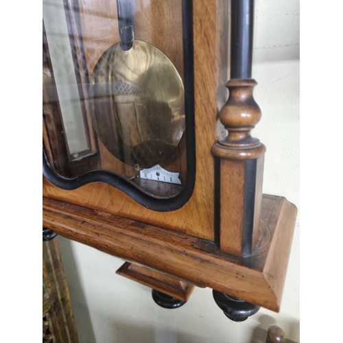 1123 - A late 19th century walnut and ebonized Vienna wall clock, with enamel dial, 114cm high, with pendul... 