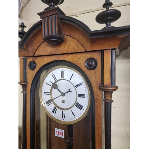 1123 - A late 19th century walnut and ebonized Vienna wall clock, with enamel dial, 114cm high, with pendul... 