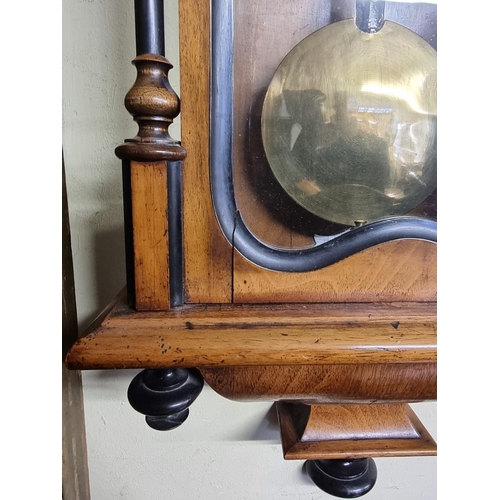 1123 - A late 19th century walnut and ebonized Vienna wall clock, with enamel dial, 114cm high, with pendul... 