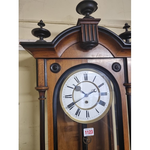 1123 - A late 19th century walnut and ebonized Vienna wall clock, with enamel dial, 114cm high, with pendul... 