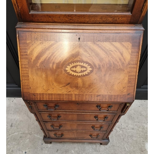 1129 - A good and small reproduction mahogany and inlaid bureau bookcase, 69cm wide. 