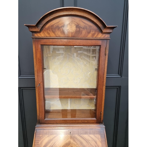 1129 - A good and small reproduction mahogany and inlaid bureau bookcase, 69cm wide. 