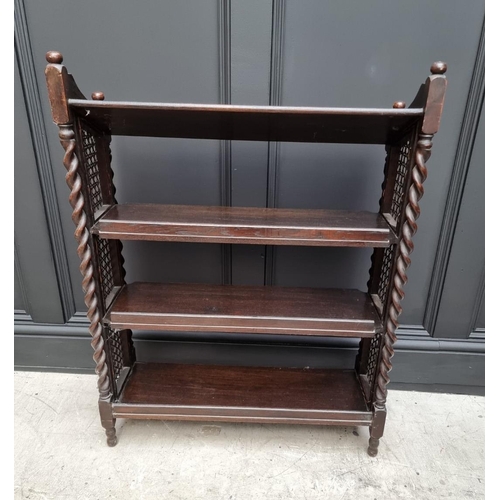 1130 - A late Victorian carved oak bookcase, 91cm wide; together with a 1920s oak and cane open bookcase, 6... 