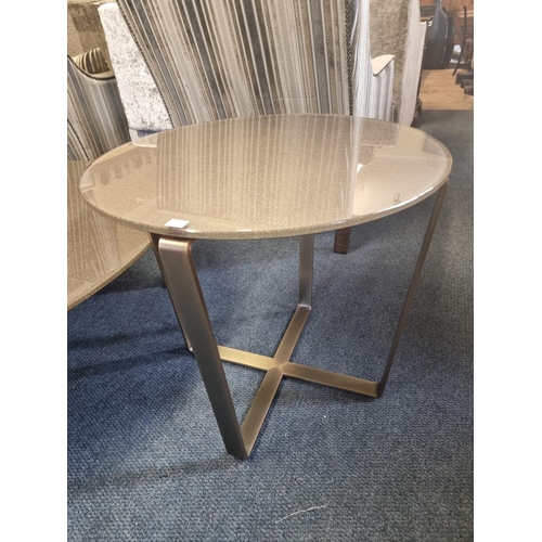 1132 - A contemporary anodized steel circular low occasional table, 120cm diameter; together with a pa... 