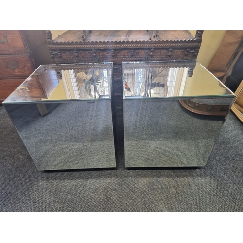 1133 - A pair of contemporary mirrored glass occasional tables, 44.5cm wide, (small chip to one). ... 