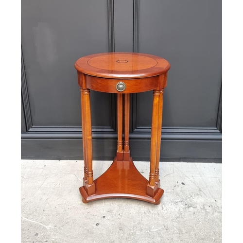 1134 - A reproduction mahogany and inlaid circular occasional table, with frieze drawer, 40cm diameter.&nbs... 