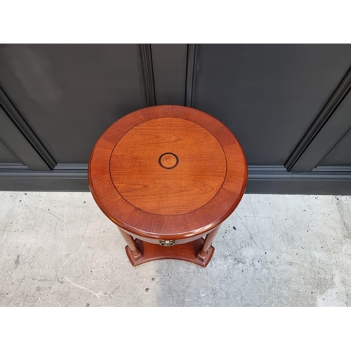 1134 - A reproduction mahogany and inlaid circular occasional table, with frieze drawer, 40cm diameter.&nbs... 