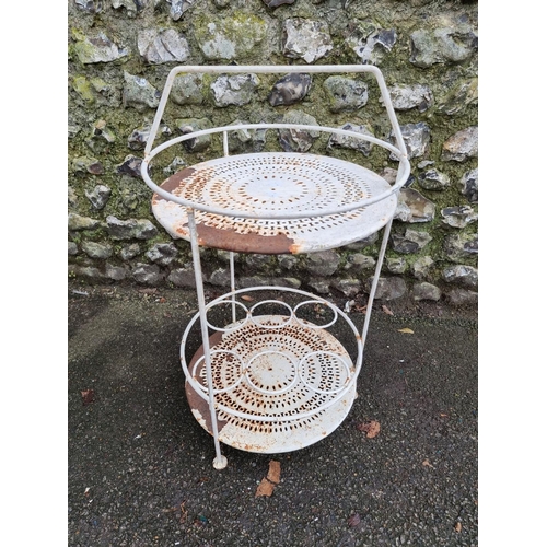 1142 - A white painted steel two tier drinks table, 74cm high x 42cm diameter.