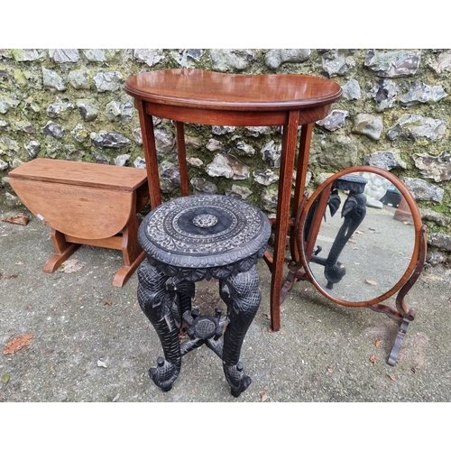 1147 - An Edwardian kidney shaped table, 59cm wide; together with an Eastern carved elephant table; a ... 