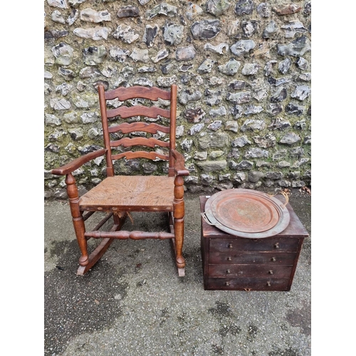 1154 - An oak ladderback rocking chair; together with a small collectors chest; and two copper trays.... 