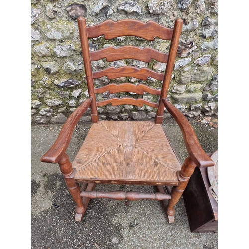 1154 - An oak ladderback rocking chair; together with a small collectors chest; and two copper trays.... 