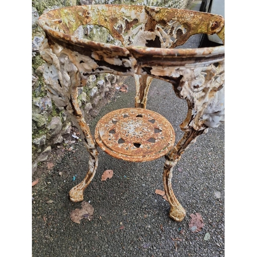 1155 - A Victorian white painted cast iron pub table base, 69cm high x 50cm diameter.